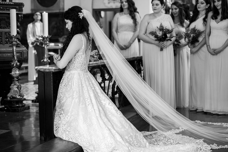 bride in veil praying los angeles wedding photographer Amy Haberland