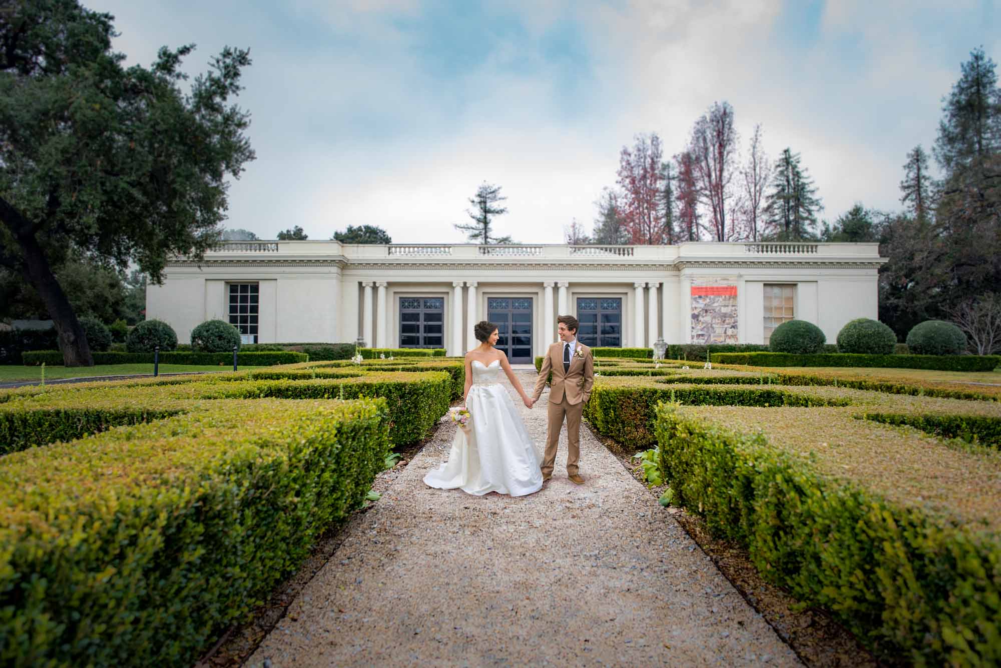 Couple holding hands at Huntington Library and gardens wedding venue