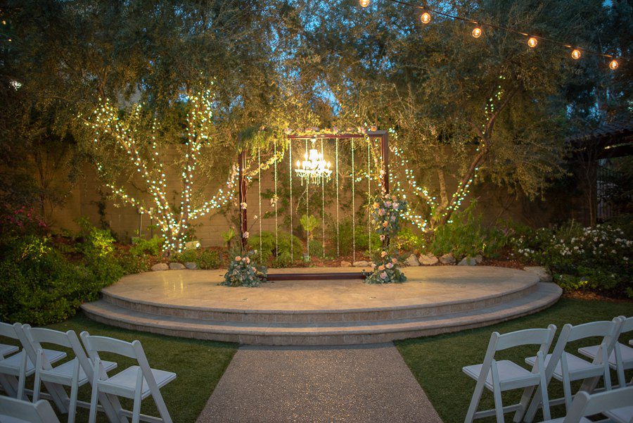 beautifully lit wedding arch with chandelier at the garland beverly park